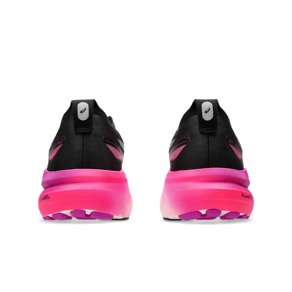 The back of a pair of Asics Women's Gel-Kayano 31 Running Shoes in the Black/Bold Magenta colourway (8365857243298)