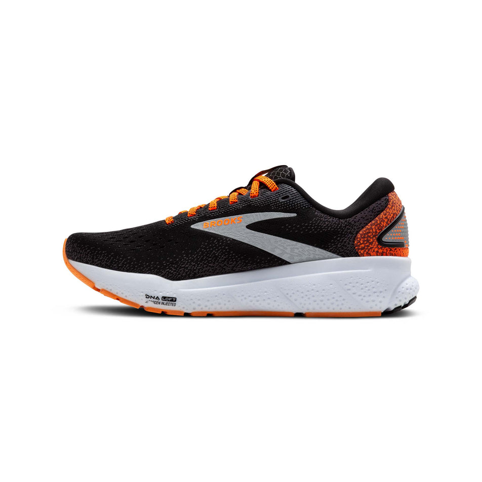 Medial side of the right shoe from a pair of Brooks Men's Ghost 16 Running Shoes in the Black/Orange/White colourway. (8519748550818)