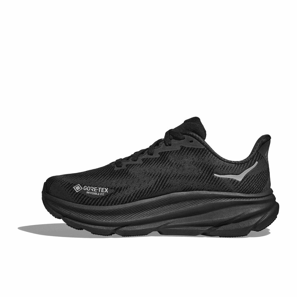 Medial side of the right shoe from a pair of HOKA Women's Clifton 9 GTX Running Shoes in the Black / Black colourway. (8566991192226)