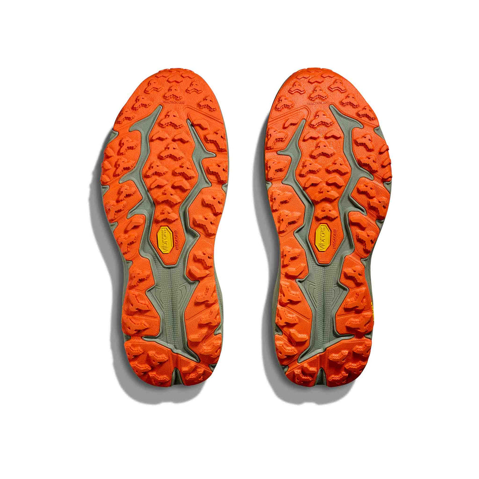 The outsoles on a pair of HOKA Men's Speedgoat 6 Running Shoes in the Antique Olive/Squash colourway (8399941075106)