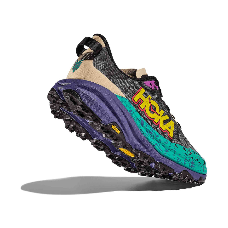 The lateral side - and outsole of - the right shoe from a pair of HOKA Women's Speedgoat 6 Running Shoes in the Oatmeal/Mountain Iris colourway. (8561697128610)