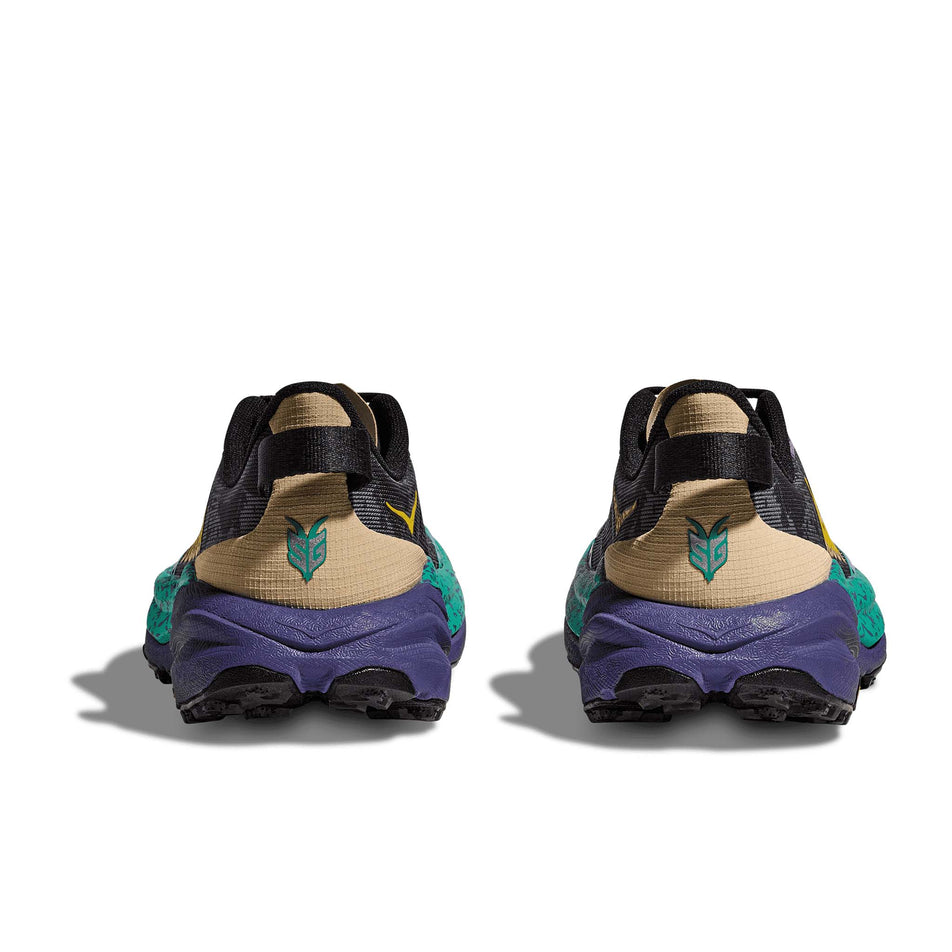 The back of a pair of HOKA Women's Speedgoat 6 Running Shoes in the Oatmeal/Mountain Iris colourway. (8561697128610)