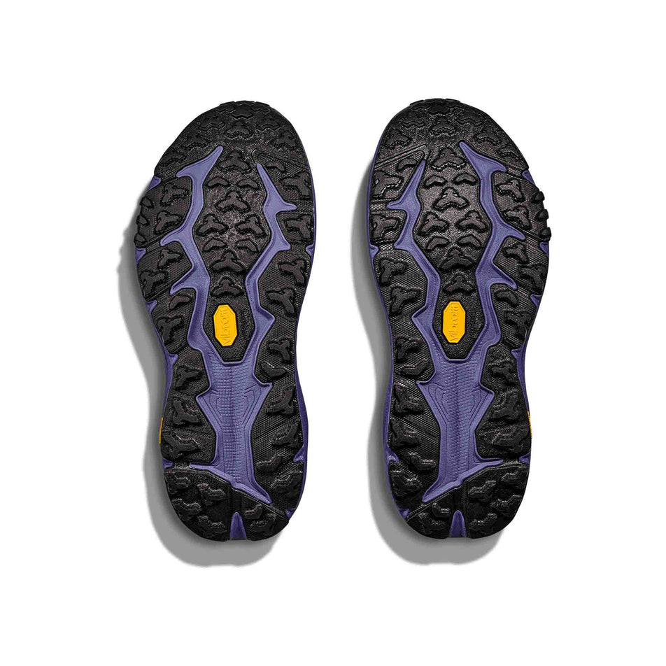 The outsoles on a pair of HOKA Women's Speedgoat 6 Running Shoes in the Oatmeal/Mountain Iris colourway. (8561697128610)