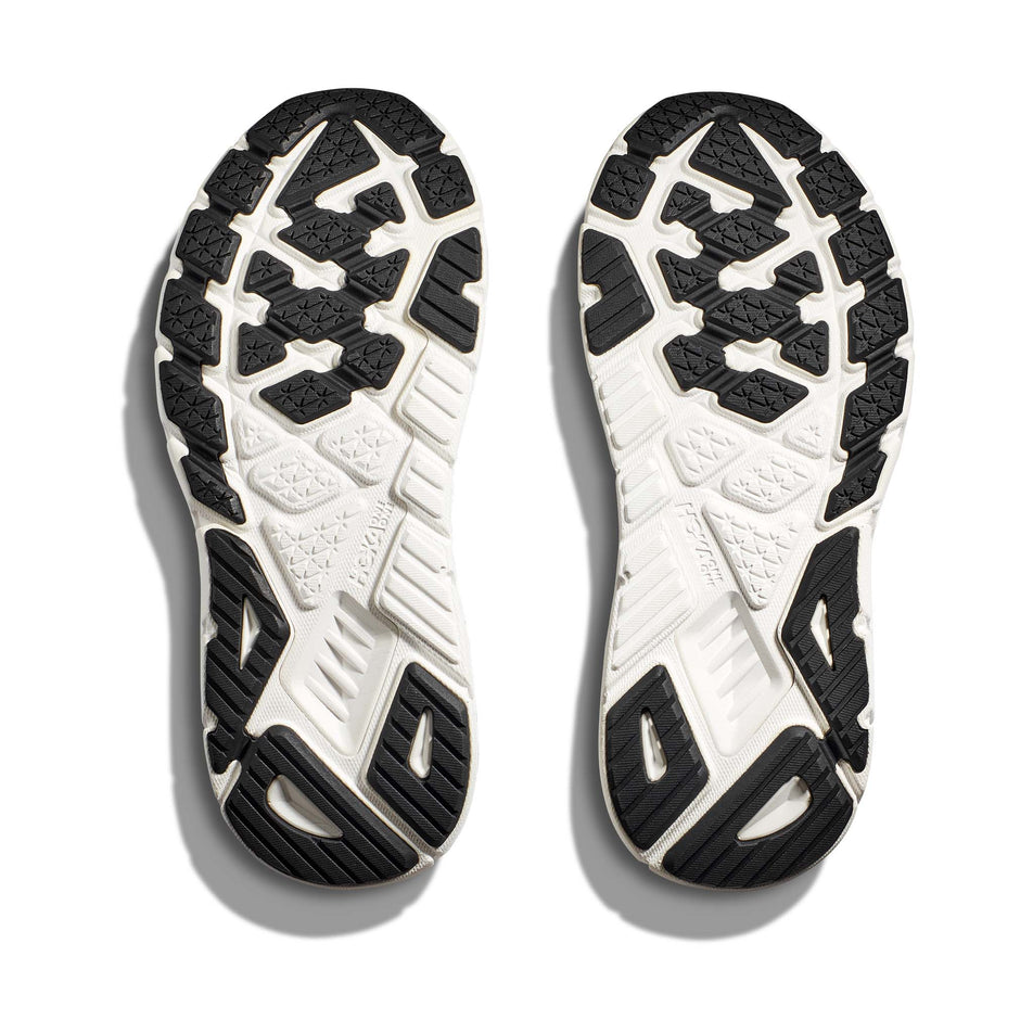 The outsoles on a pair of HOKA Women's Arahi 7 Wide Running Shoes in the Black/White colourway (8146247123106)