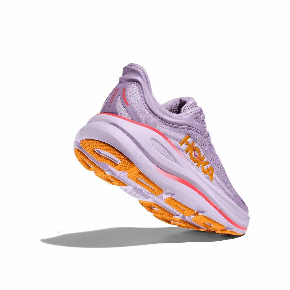 Lateral side - and outsole - of the right shoe from a pair of HOKA Women's Bondi 9 Running Shoes in the Aster Flower/Starlight Glow colourway. (8569210536098)