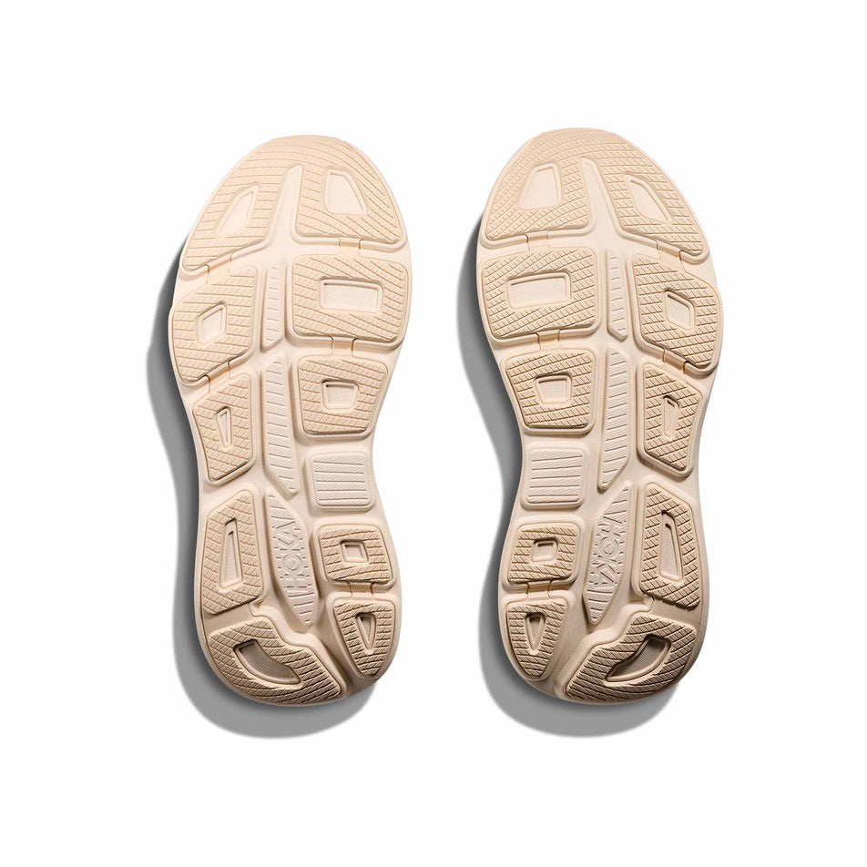 The outsoles on a pair of HOKA Women's Bondi 9 Running Shoes in the Vanilla/Birch colourway. (8580395565218)