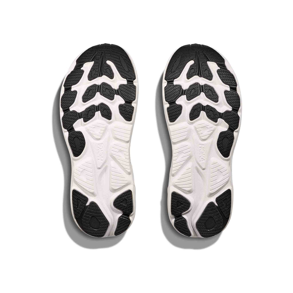 The outsoles of a pair of HOKA Women's Clifton 10 Running Shoes in the Black/White colourway. (8637752115362)