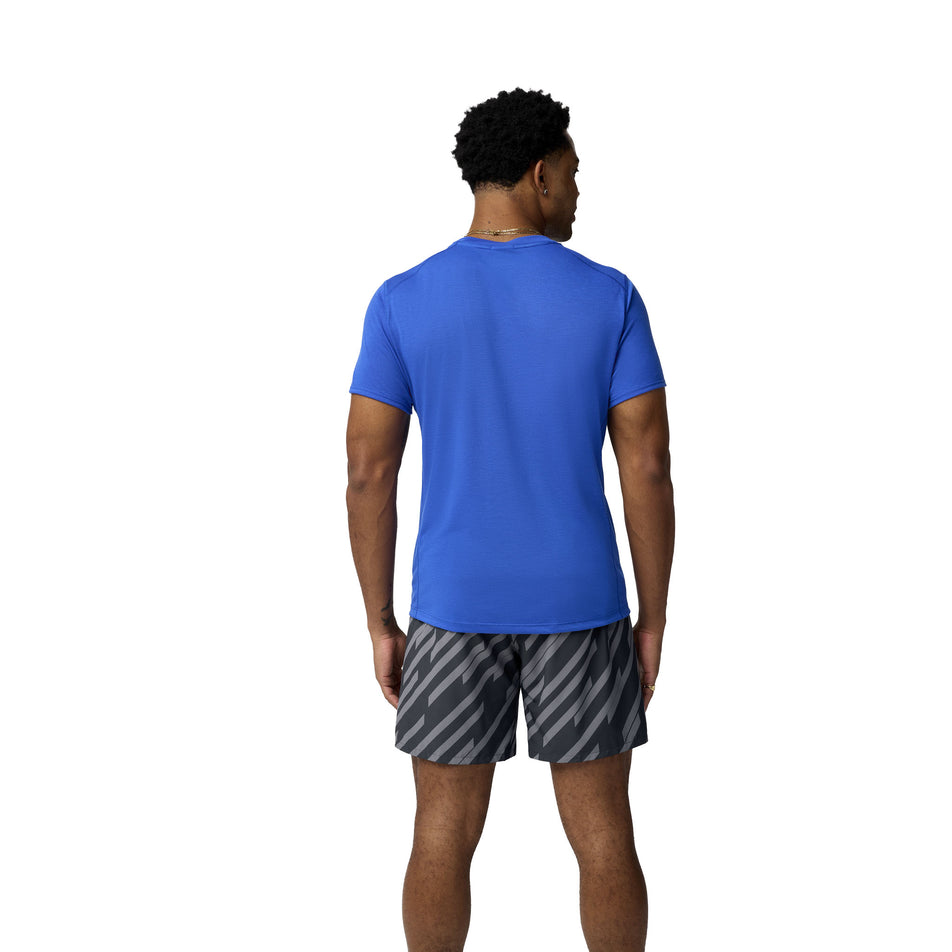 Back view of a model wearing the Brooks Men's Distance Short Sleeve 3.0 in the Neo Blue/Brooks Logo colourway. (8575020662946)