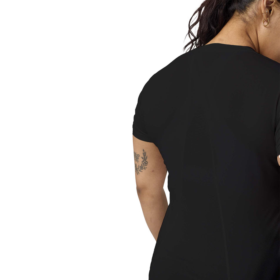 Back view of a model wearing the Brooks Women's Sprint Free Short Sleeve 3.0 in the Black colourway. (8575025414306)