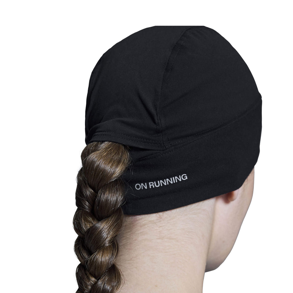 Back view of a model wearing an On Core Beanie in the Black colourway.  (8534546186402)