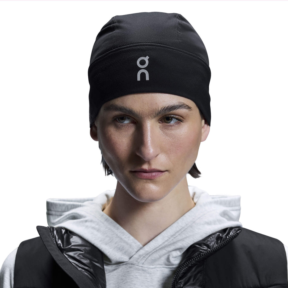 Front view of a model wearing an On Core Beanie in the Black colourway.  (8534546186402)