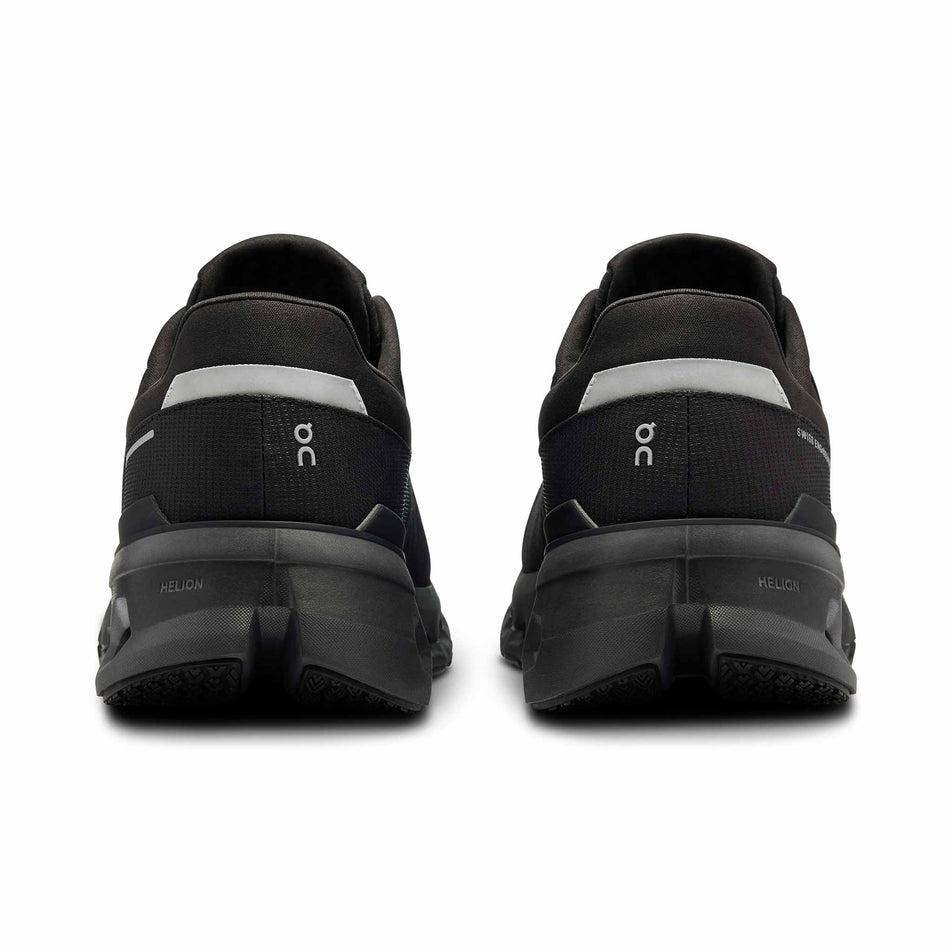 The back of a pair of On Men's Cloudrunner 2 Waterproof Running Shoes in the Magnet/Black colourway. (8534537633954)