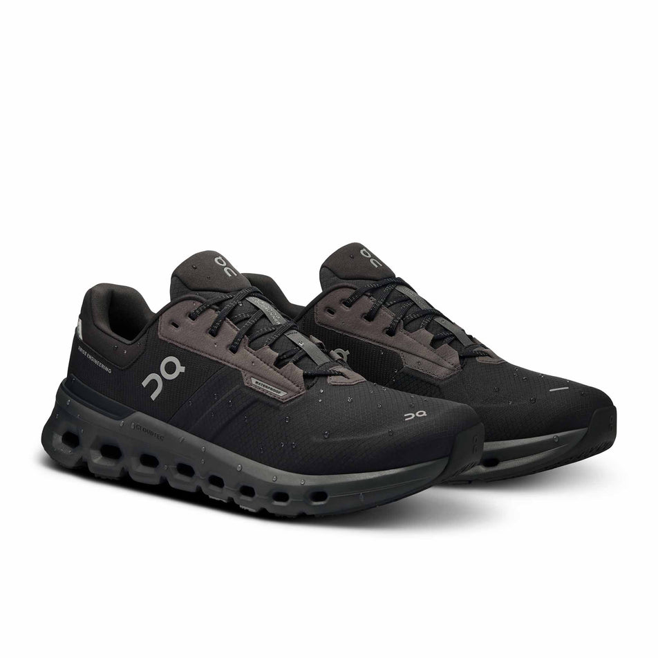 A pair of On Men's Cloudrunner 2 Waterproof Running Shoes in the Magnet/Black colourway. There water droplets on the shoes.  (8534537633954)