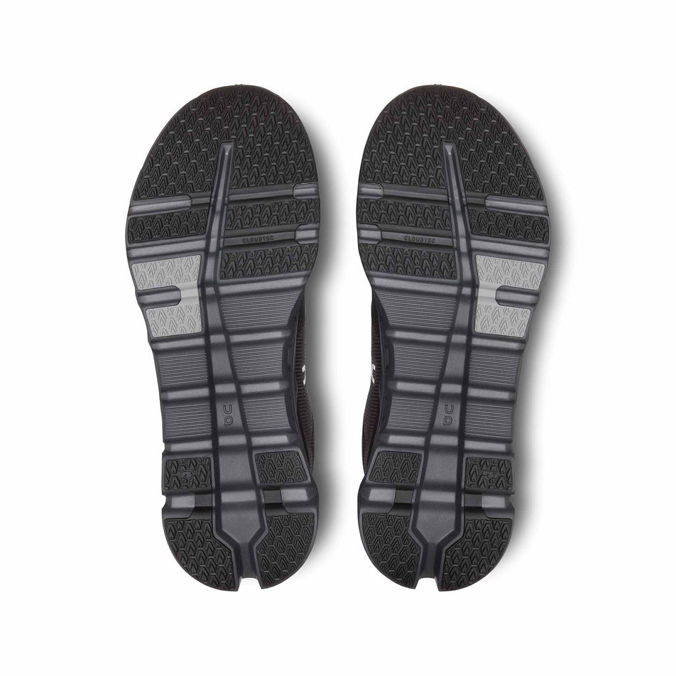 The outsoles on a pair of On Men's Cloudrunner 2 Waterproof Running Shoes in the Magnet/Black colourway. (8534537633954)