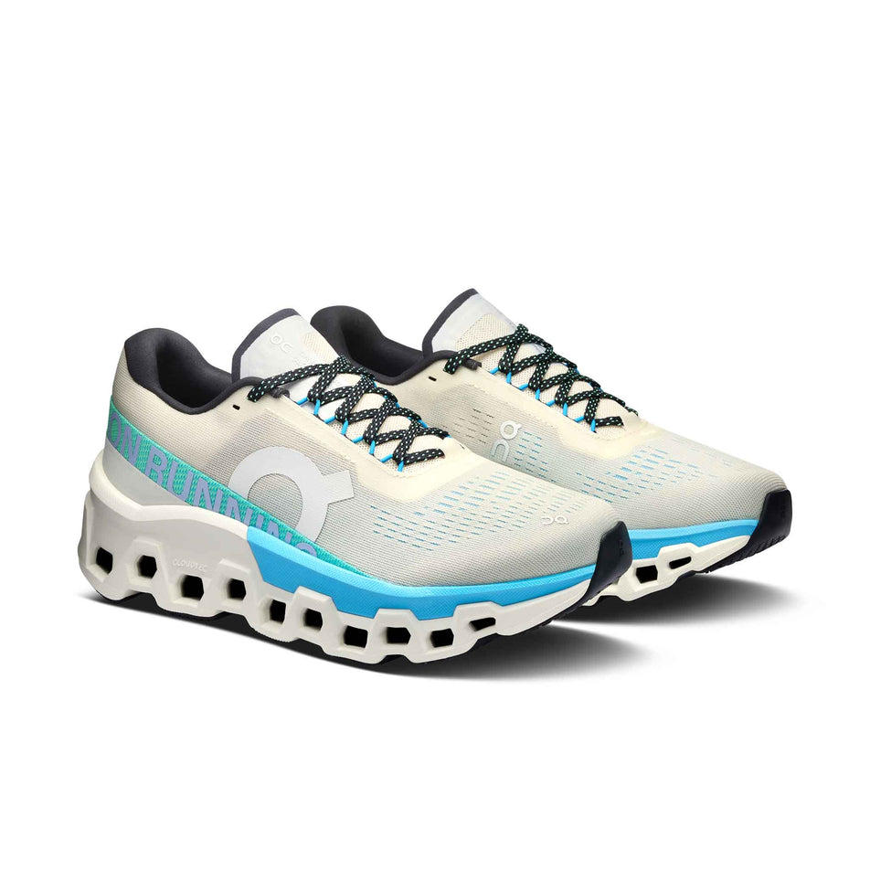 A pair of On Women's Cloudmonster 2 Running Shoes in the Cream/Horizon colourway. (8562846498978)