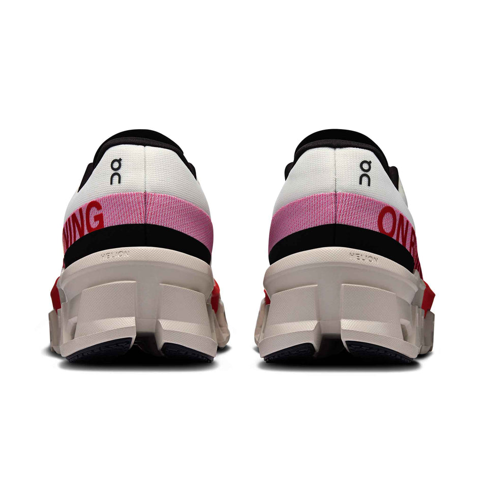 The back of a pair of On Women's Cloudmonster 2 Running Shoes in the Ivory/Red colourway. (8577870364834)