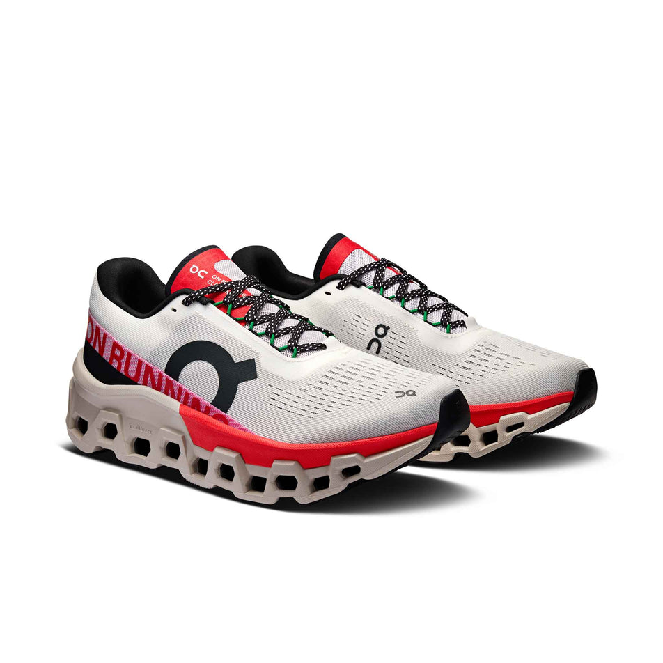 A pair of On Women's Cloudmonster 2 Running Shoes in the Ivory/Red colourway. (8577870364834)