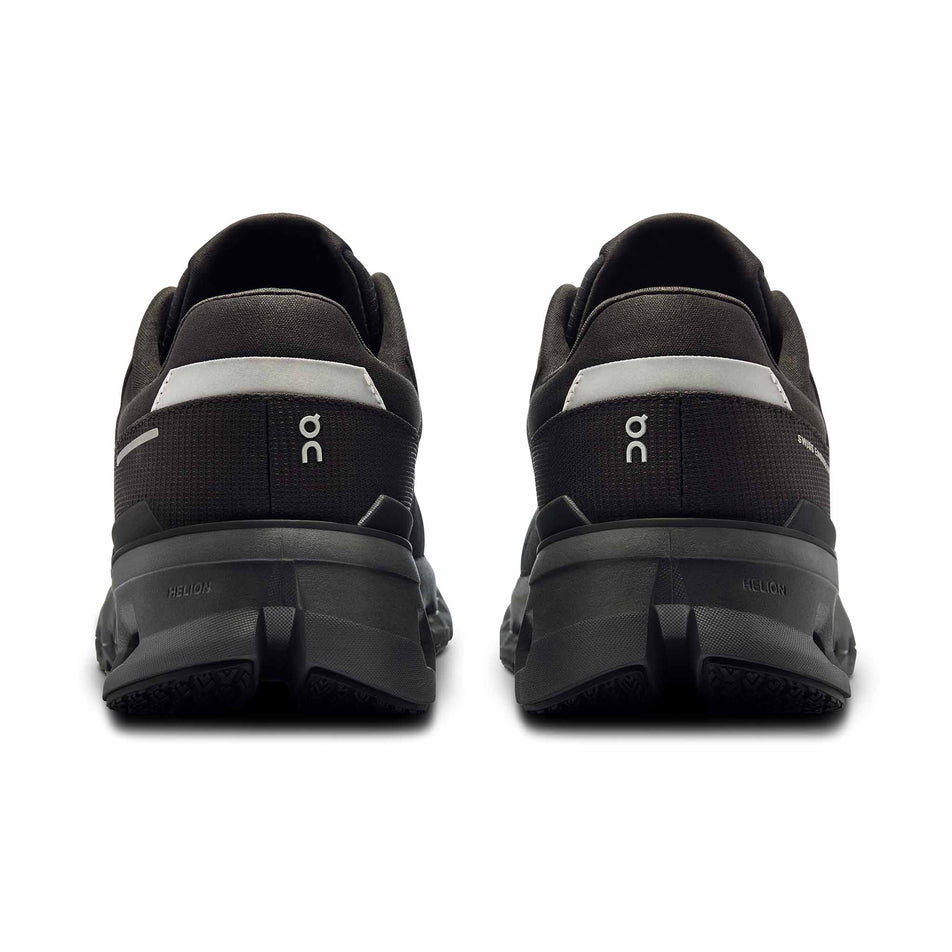 The back of a pair of On Women's Cloudrunner 2 Waterproof Running Shoes in the Magnet/Black colourway. (8534539600034)