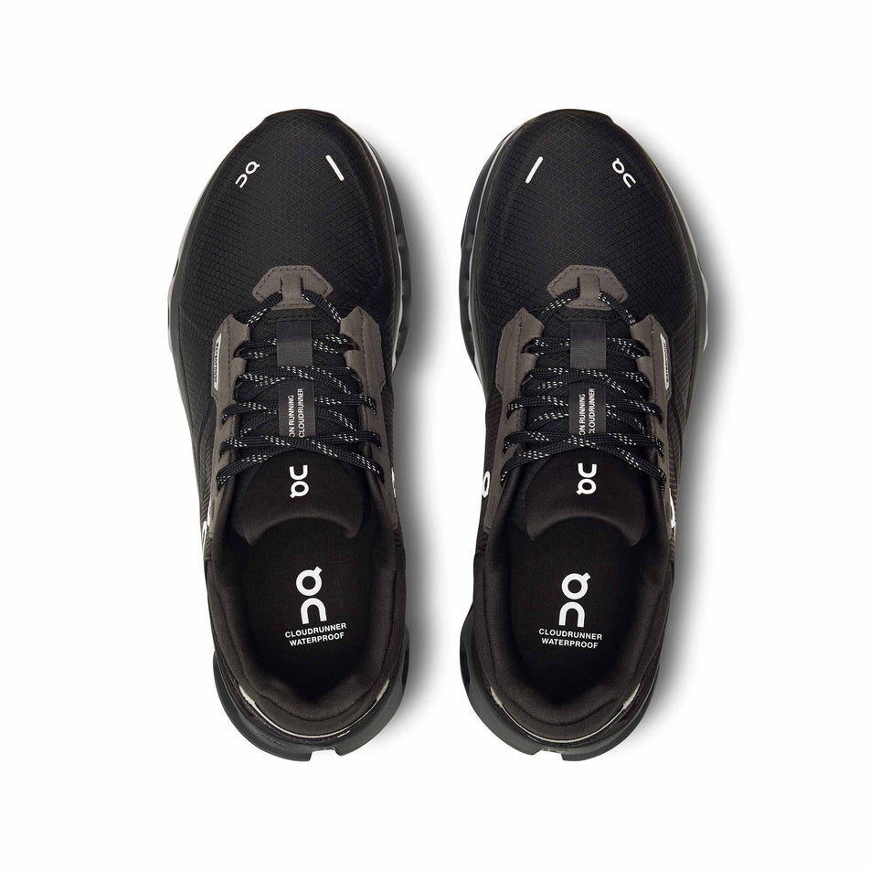 The uppers on a pair of On Women's Cloudrunner 2 Waterproof Running Shoes in the Magnet/Black colourway. (8534539600034)