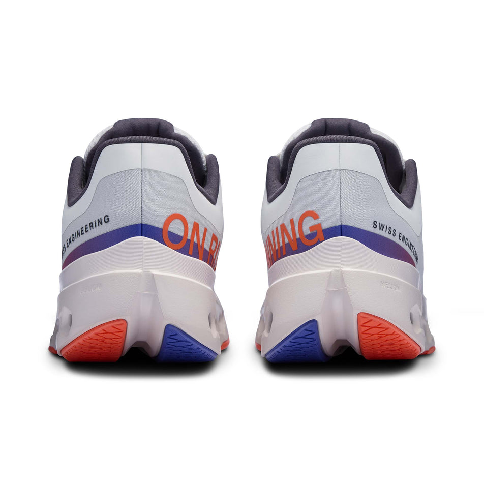 The back of a pair of On Women's Cloudsurfer Next Running Shoes in the White/Flame colourway (8444679520418)