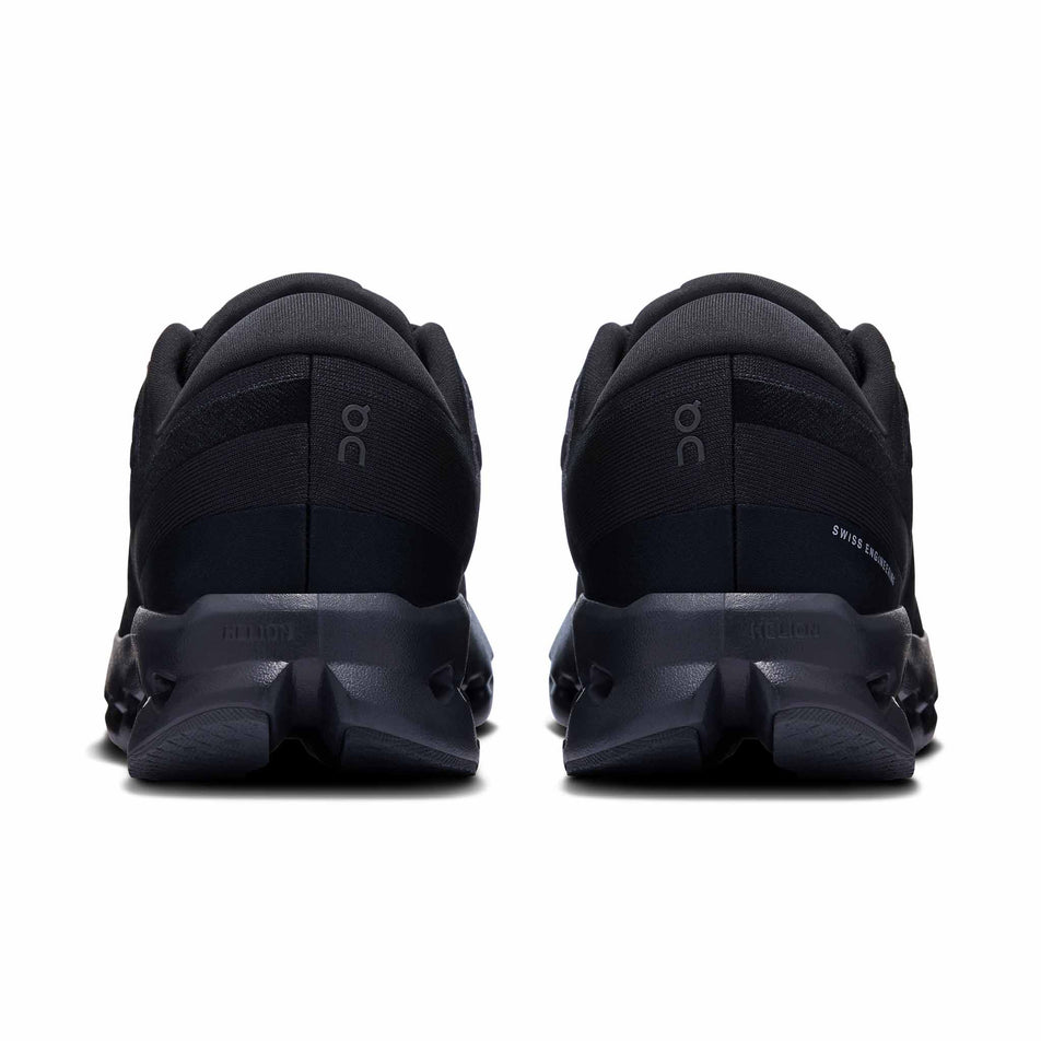 The back of a pair of On Women's Cloudsurfer 2 Running Shoes in the Black/Black colourway. (8577864007842)