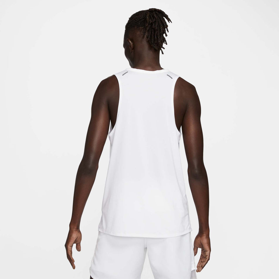 Back view of a model wearing a Nike Men's Rise 365 Dri-FIT Running Tank in the White/Reflective Silv colourway. Model is also wearing Nike shorts. (8409892651170)