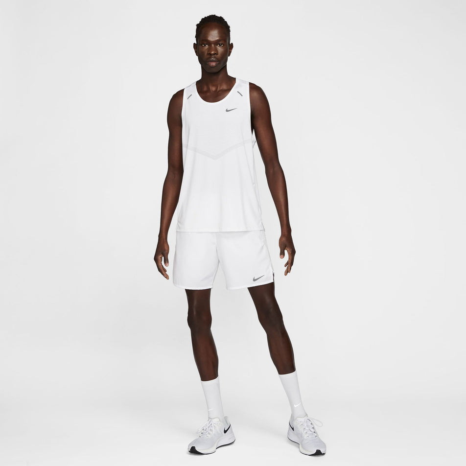 Front view of a model wearing a Nike Men's Rise 365 Dri-FIT Running Tank in the White/Reflective Silv colourway. Model is also wearing Nike shorts, socks and shoes. (8409892651170)