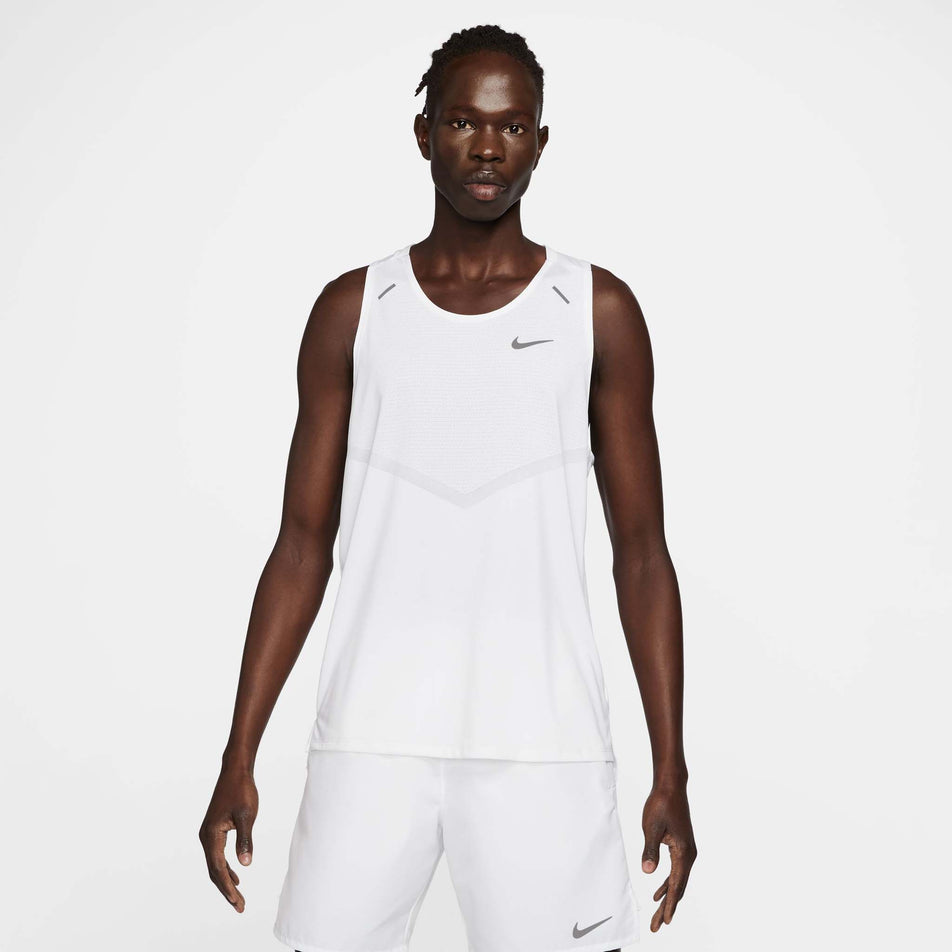 Front view of a model wearing a Nike Men's Rise 365 Dri-FIT Running Tank in the White/Reflective Silv colourway. Model is also wearing Nike shorts. (8409892651170)