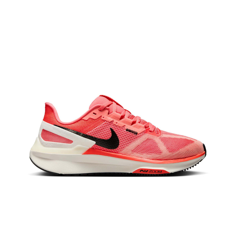 Lateral side of the right shoe from a pair of Nike Women's Structure 25 Road Running Shoes in the Magic Ember/White-Sail-Apricot Agate colourway. (8558441529506)