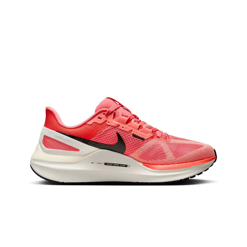 Medial side of the left shoe from a pair of Nike Women's Structure 25 Road Running Shoes in the Magic Ember/White-Sail-Apricot Agate colourway. (8558441529506)