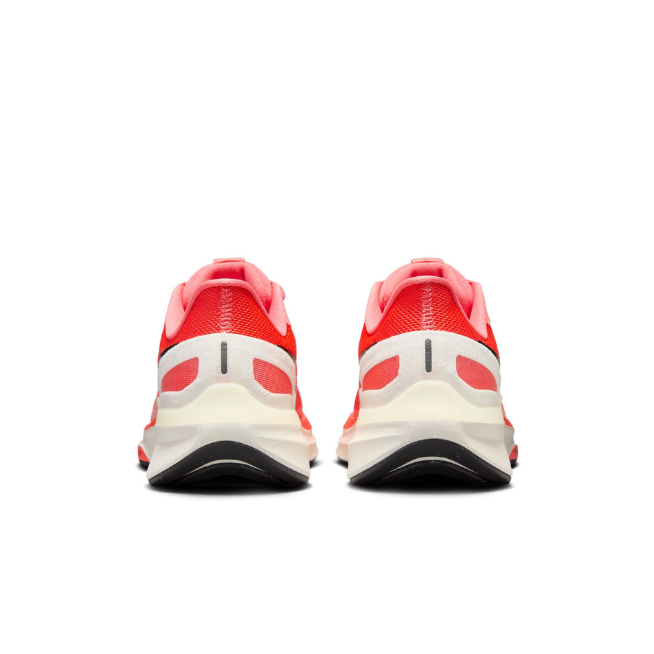 The back of a pair of Nike Women's Structure 25 Road Running Shoes in the Magic Ember/White-Sail-Apricot Agate colourway. (8558441529506)