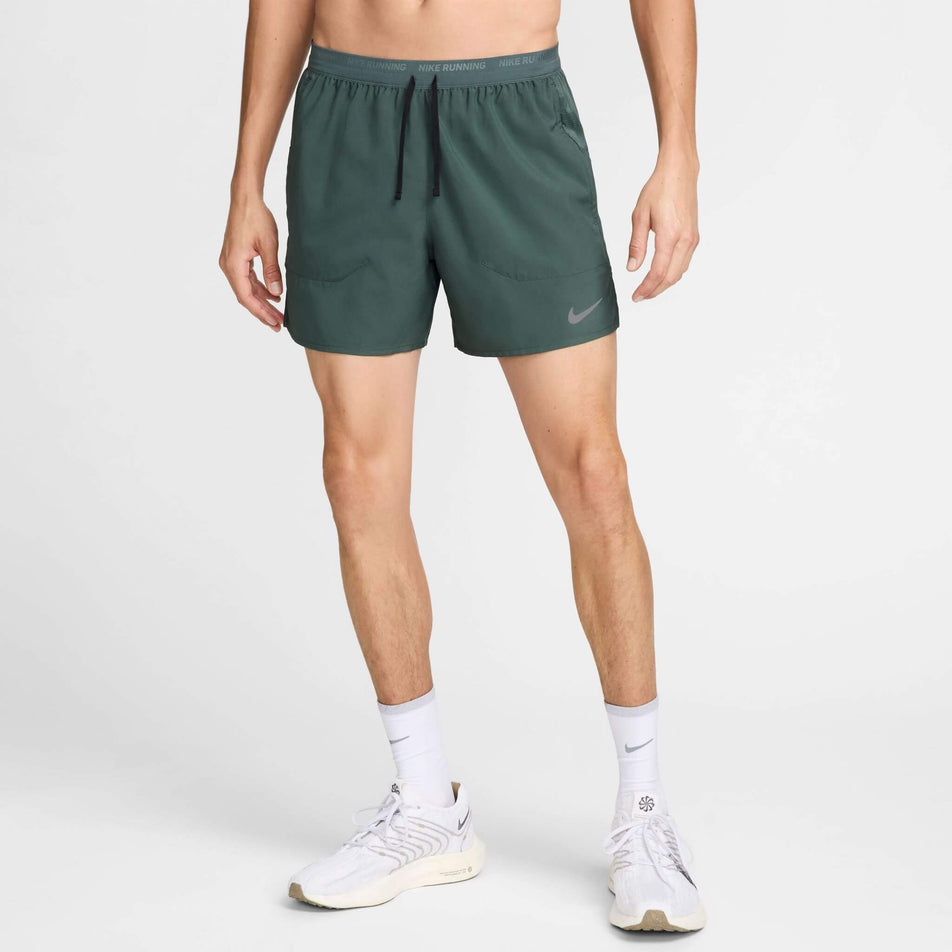 Front view of a model wearing a pair of Nike in the Men's Stride Dri-FIT 5