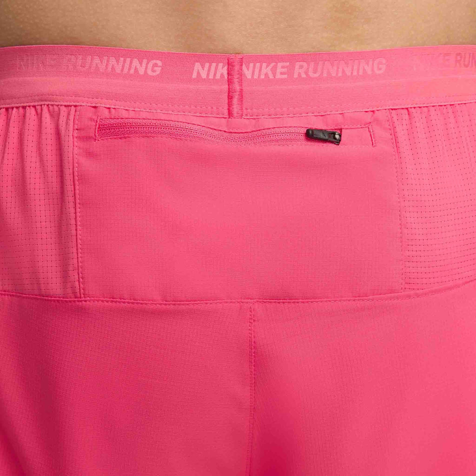 Close-up view of the zipped back pocket on a pair of Nike Men's Stride Dri-FIT 5