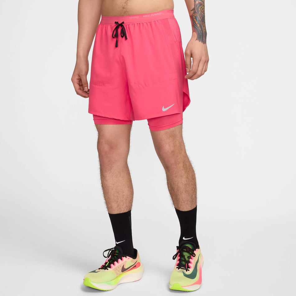 Angled front view of a model wearing a pair of Nike Men's Stride Dri-FIT 5