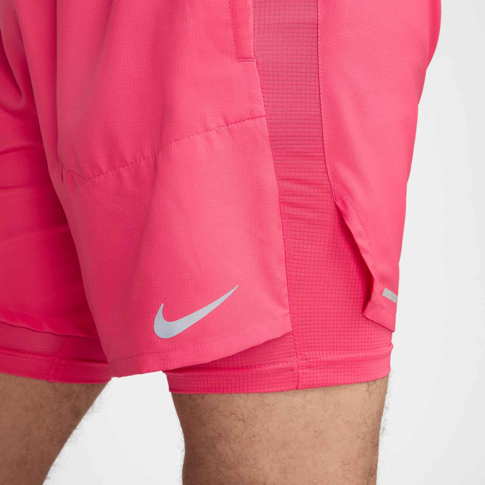 Close-up view of the lower left-side section of a pair of Nike Men's Stride Dri-FIT 5