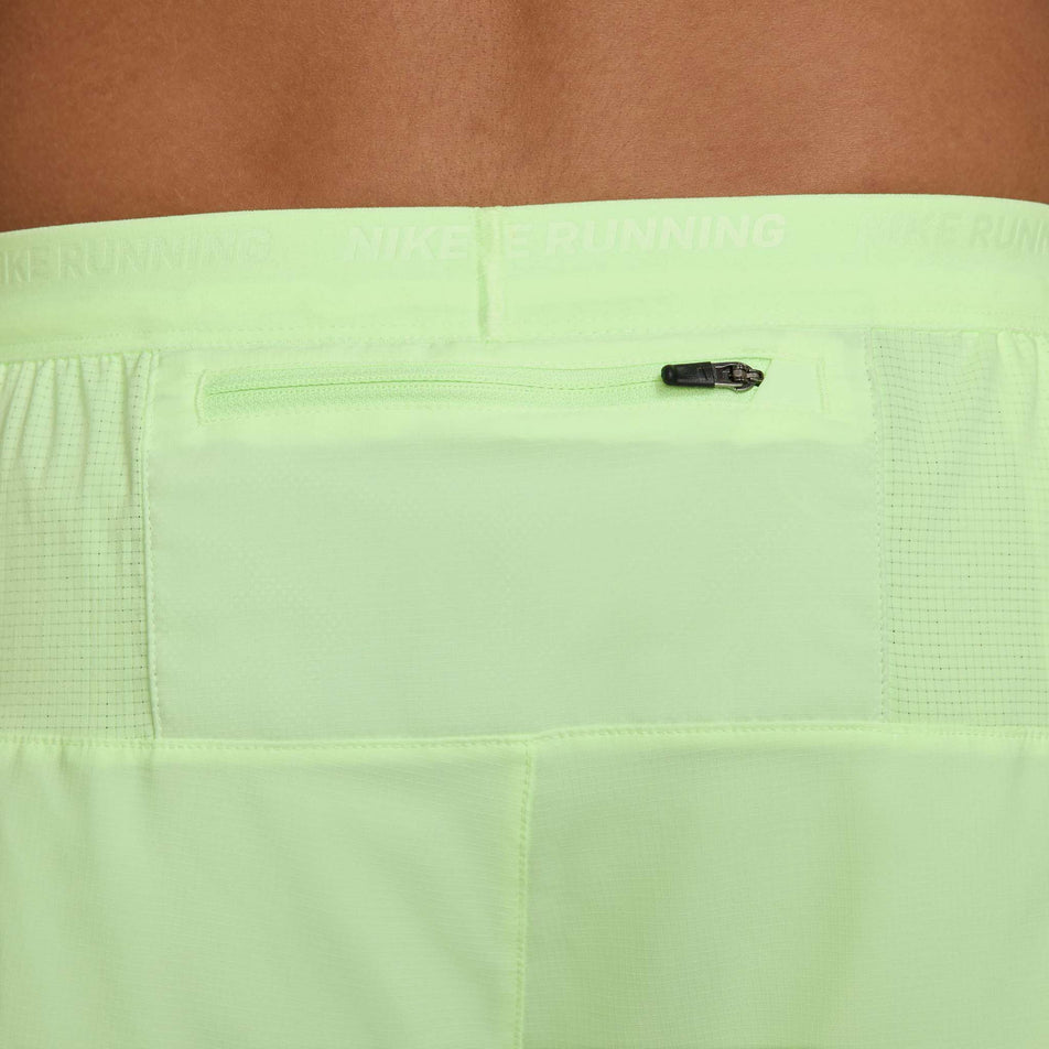 Close-up view of the zipped back pocket on a pair of Nike Men's Stride Dri-FIT 5