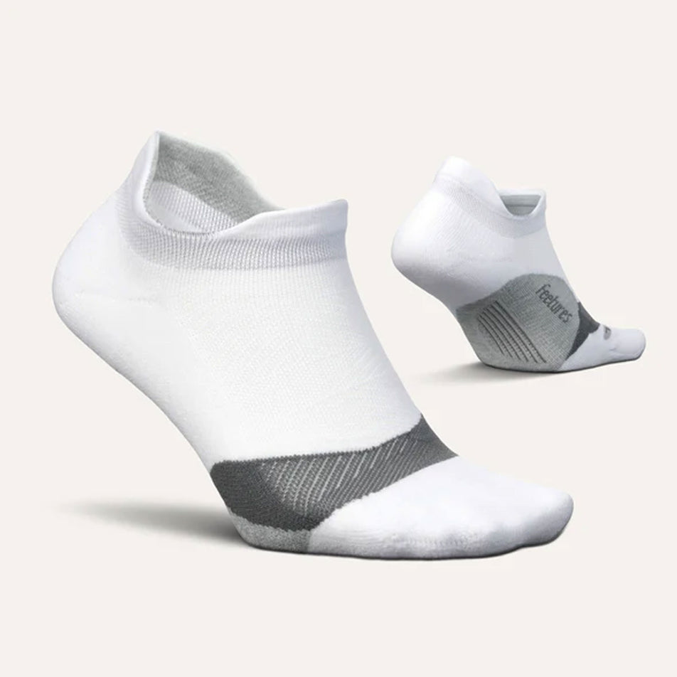 A pair of Feetures Unisex Elite Light Cushion No Show Tab running socks in the White colourway (8149350514850)