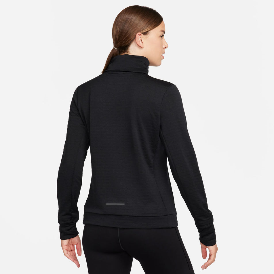 Back view of a model wearing a Nike Women's Swift Element Therma-FIT Turtleneck Running Top in the Black/Reflective Silver colourway. Model is also wearing black Nike shorts. (8497637752994)