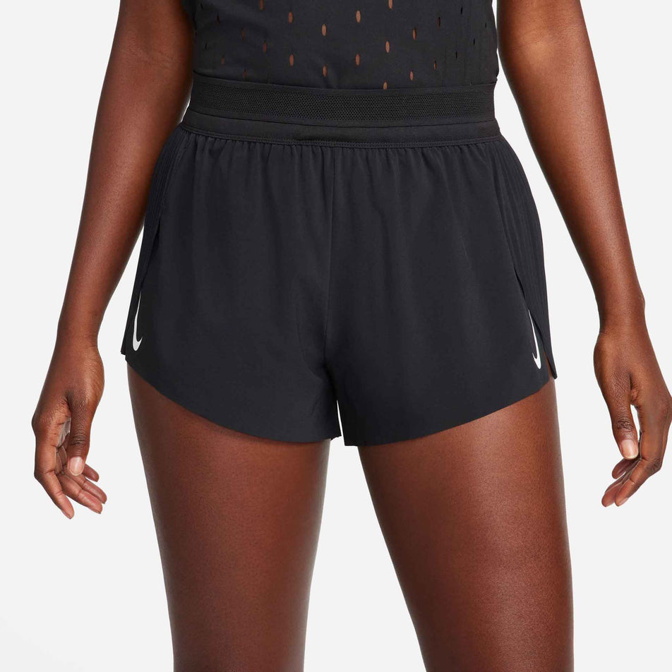 Front view of a model wearing a pair of Nike Women's AeroSwift Dri-FIT ADV Mid-Rise Brief-Lined 3