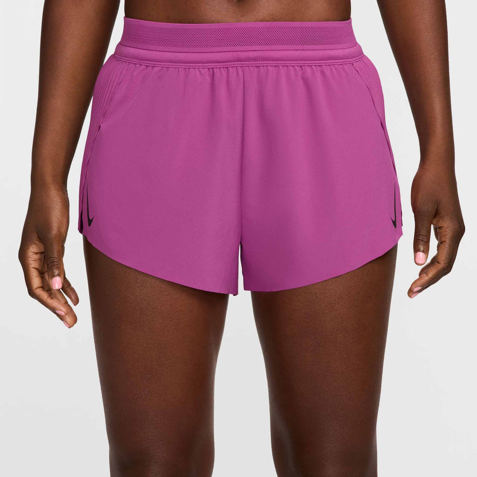 Front view of a model wearing a pair of Nike Women's AeroSwift Dri-FIT ADV Mid-Rise Brief-Lined 3