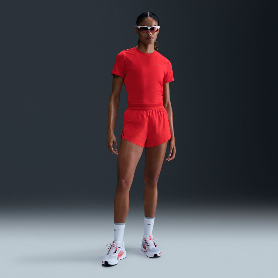 Front view of a model wearing the Nike Women's AeroSwift Dri-FIT ADV Mid-Rise Brief-Lined 3