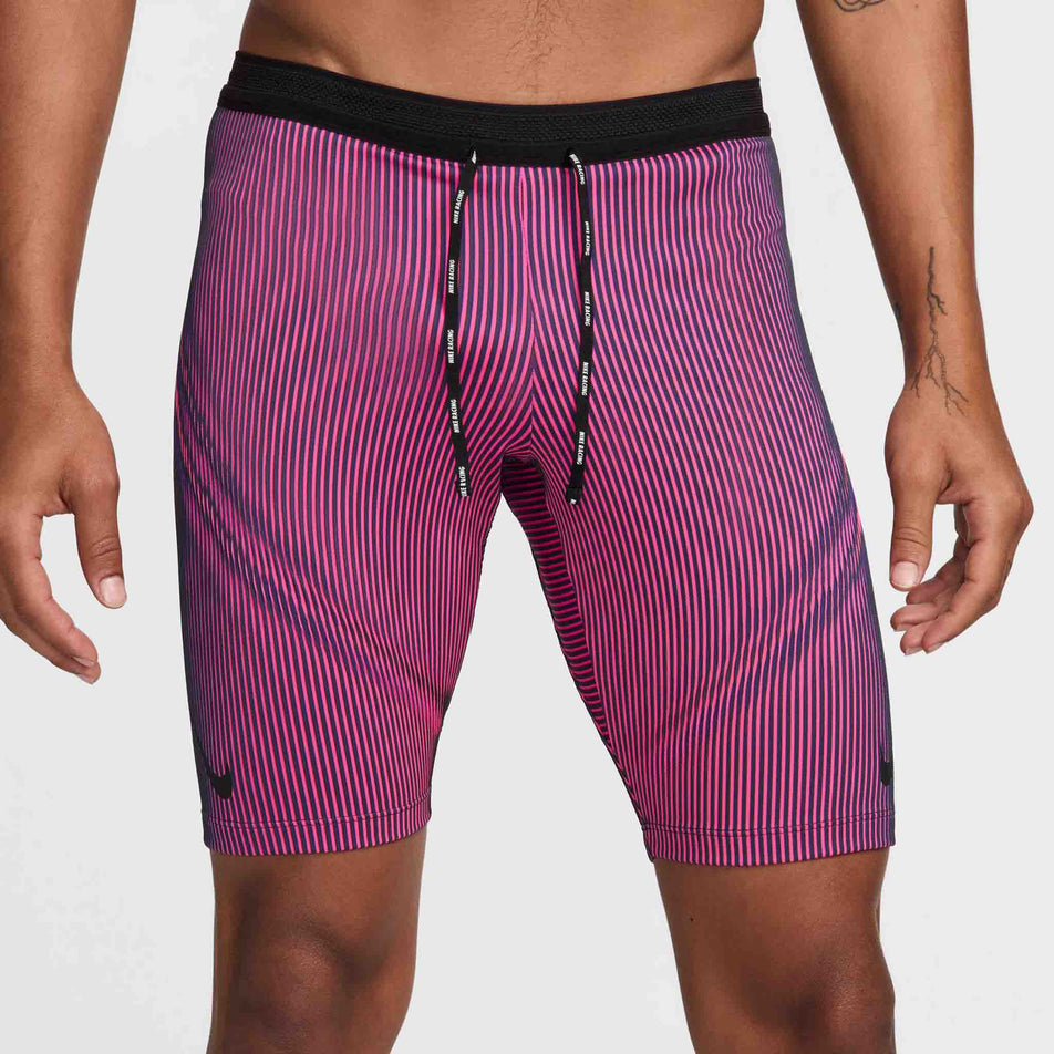 Front view of a model wearing a pair of Nike Men's Dri-FIT Aeroswift Brief-Lined Half Tights in the Anthracite/Hyper Pink/Court Purple Black colourway. (8483561013410)