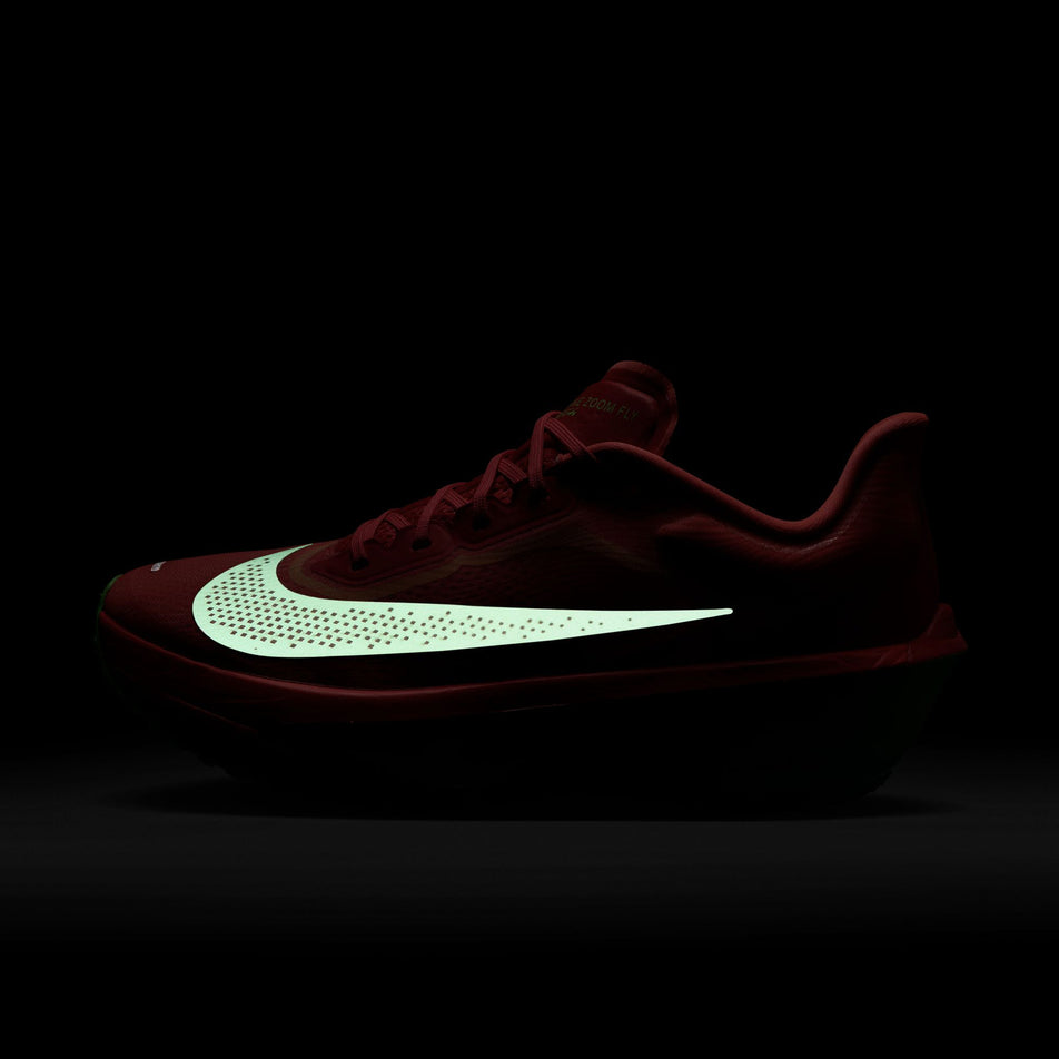 The reflective Swoosh on the lateral side of the left shoe from a pair of Nike Women's Zoom Fly 6 Running Shoes in the Bright Crimson/Cave Purple-Lime Blast colourway. (8571094663330)