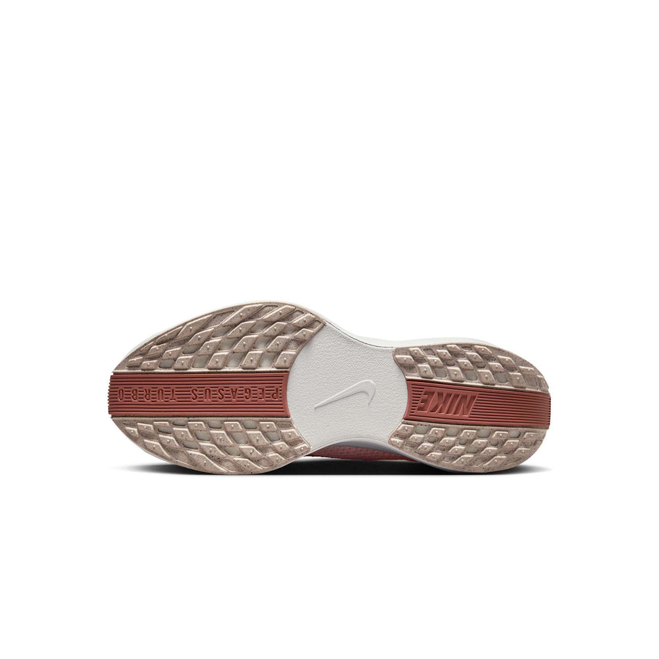 Outsole of the left shoe from a pair of Nike Women's Pegasus Plus Road Running Shoes in the Crimson Tint/White-Pure Platinum colourway (8449389166754)