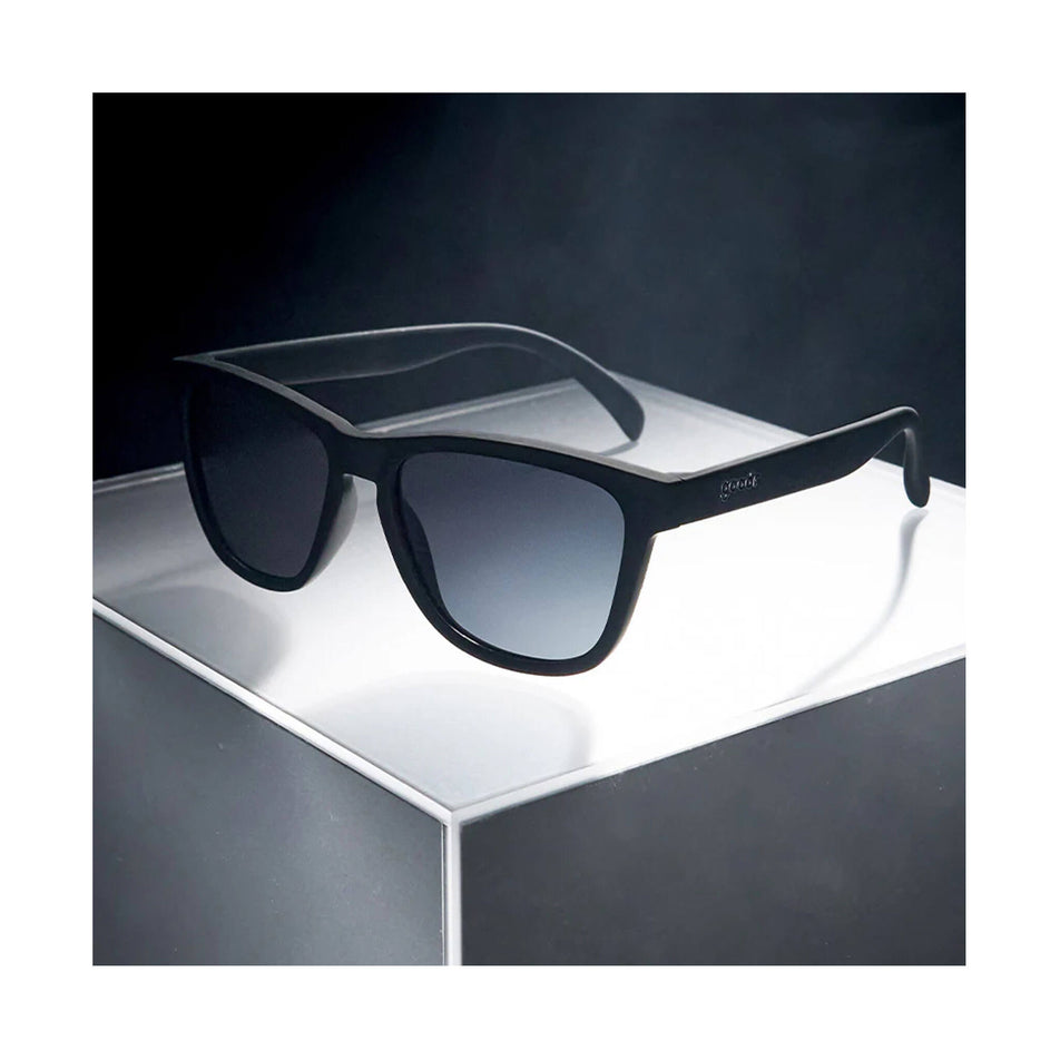 A pair of goodr OG Running Sunglasses in the A Unicorn's Calamity style. Glasses are sitting on a flat surface. (8454437011618)