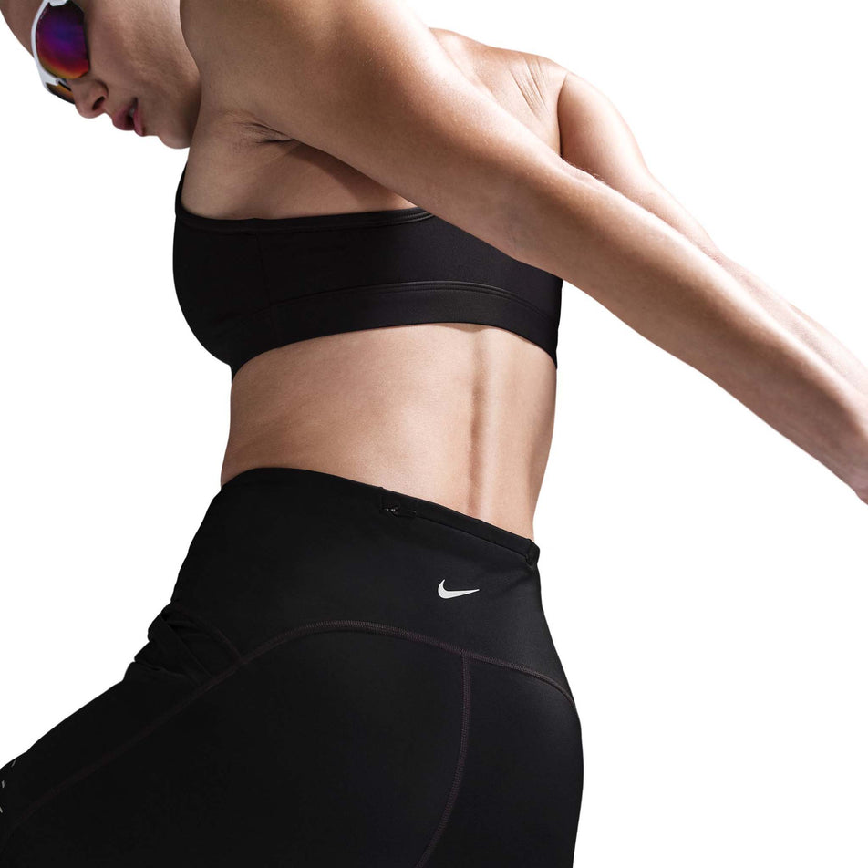 Back view of a model wearing Nike Women's Swift Dri-FIT High-Rise 4