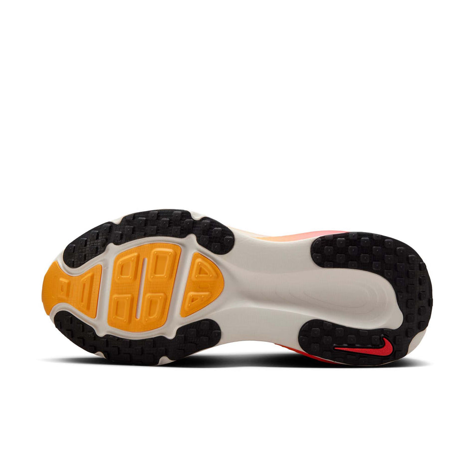 The outsole of the left shoe from a pair of Nike Women's Vomero 18 Road Running Shoes in the Sail/Black-Bright Crimson-Laser Orange colourway. (8574700945570)