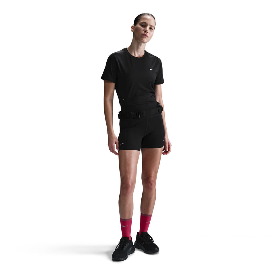 Front view of a model wearing a Nike Women's Swift Dri-FIT Short-Sleeve Running Top in the Black/Reflective Silver colourway. (8560479404194)