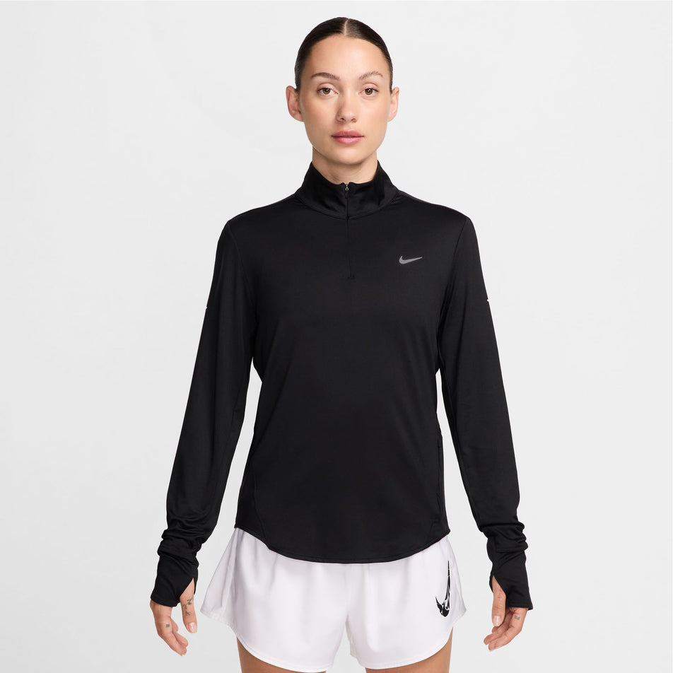 Front view of a model wearing a Nike Women's Swift Fri-FIT UV Half-Zip Long Sleeve Running Top in the Black/Reflective Silver colourway. (8560809312418)