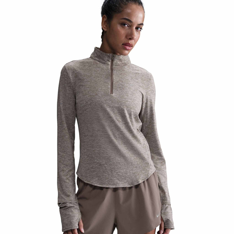 Front view of a model wearing a Nike Women's Swift Dri-FIT UV 1/4-Zip Long Sleeve Running Top in the Mink Brown/Heather/Reflective Silver colourway. (8560845422754)